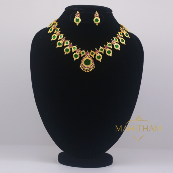 Green Palakka Mahima Necklace eith Ruby Red Stones paired with ear studs is a traditionally handcrafted South Indin One gram Gold Jewellery Set