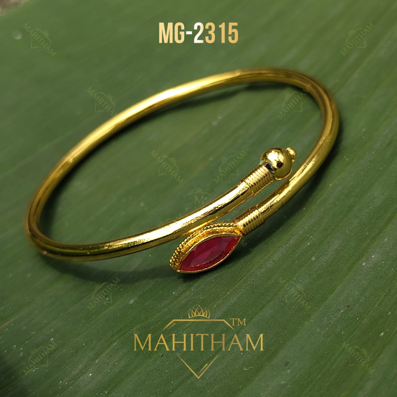 Ruby Oval Adjustable Bangle MG-2315 showing open adjustable design, ruby-red oval stone and gold-finish detailing