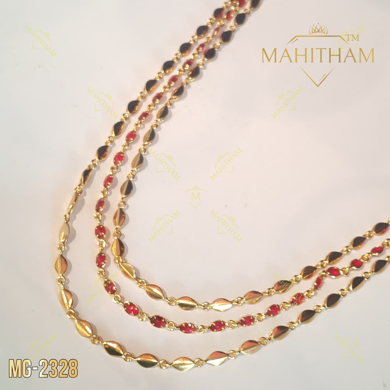 Full view of Mahitham three-layer Avil chain necklace with red stones, displayed on a jewellery bust_1