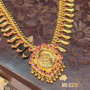 Close-up of Lakshmi motif pendant on Golden Nagapadam Necklace MG-2329 with ruby-pink stones and decorative gold hanging drops.
